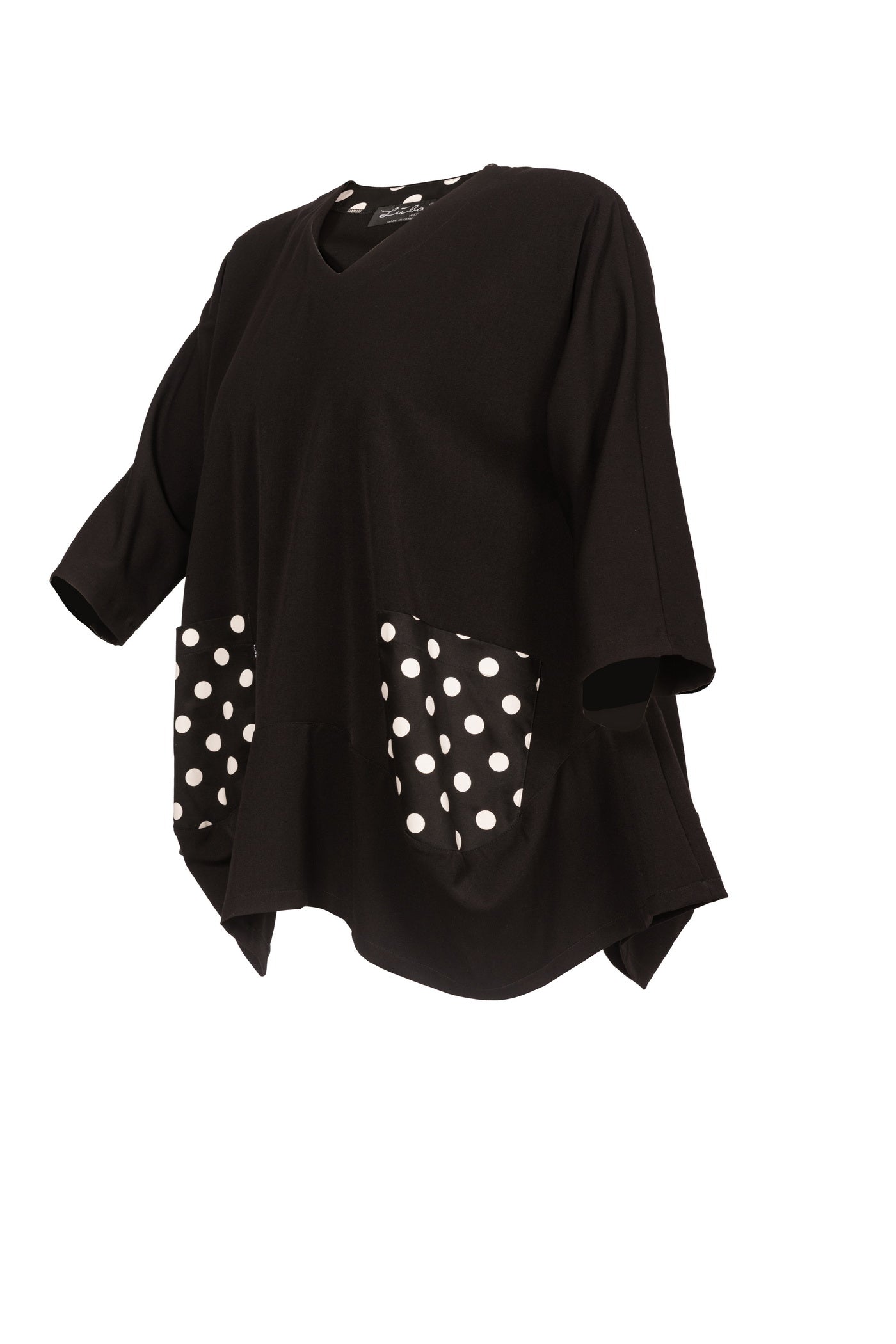 Stilvolle schwarze Tunika mit 2 Taschen, abgesetzt durch weiße Punkte.