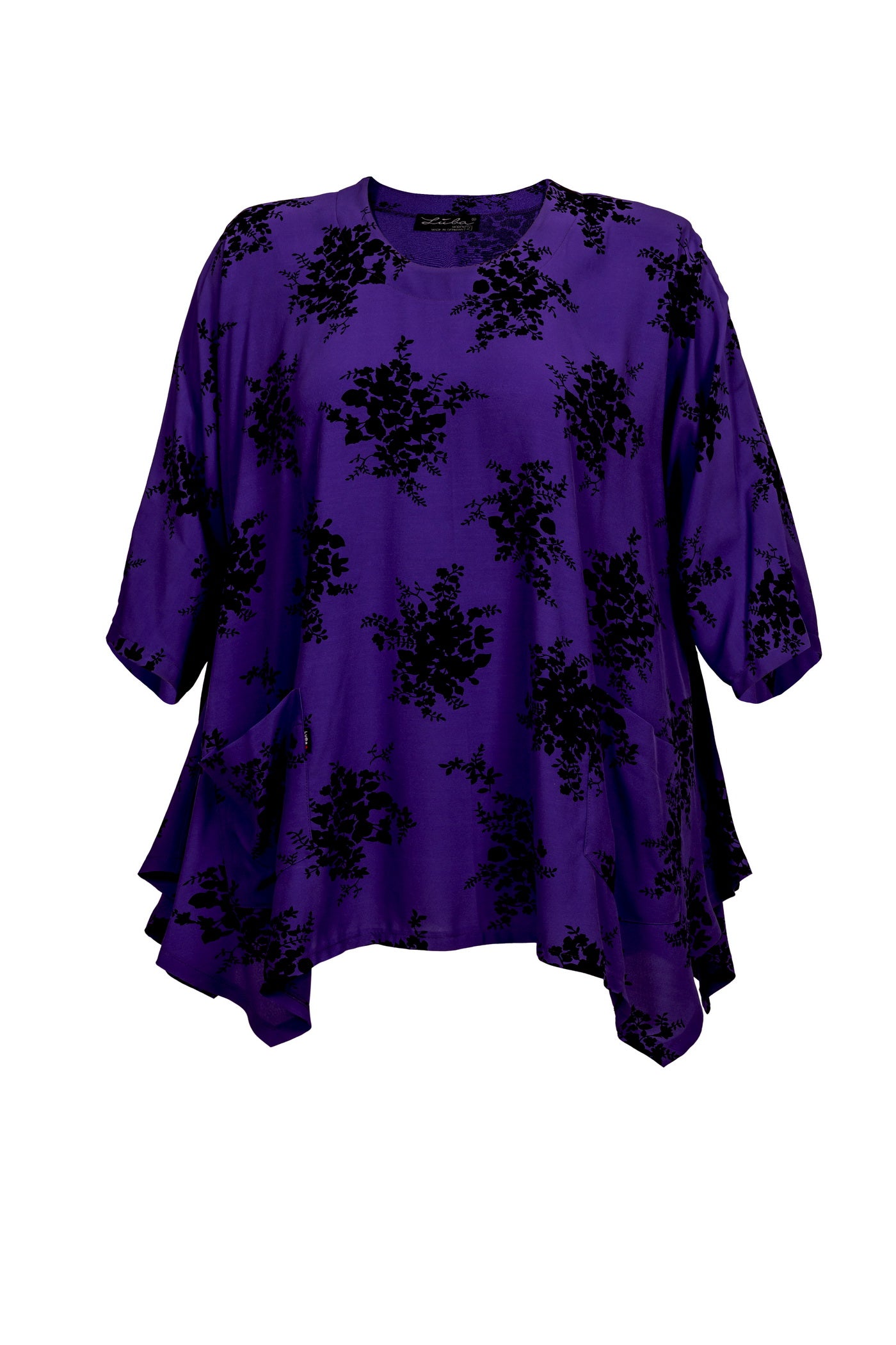 Weiche lila Viskose-Tunika mit schwarzem Blumenmuster und Zipfelsaum.